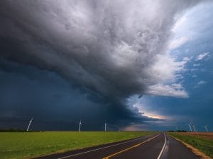Storm over road and windmills 