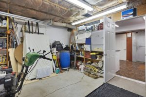 Garage with stuff laying around 
